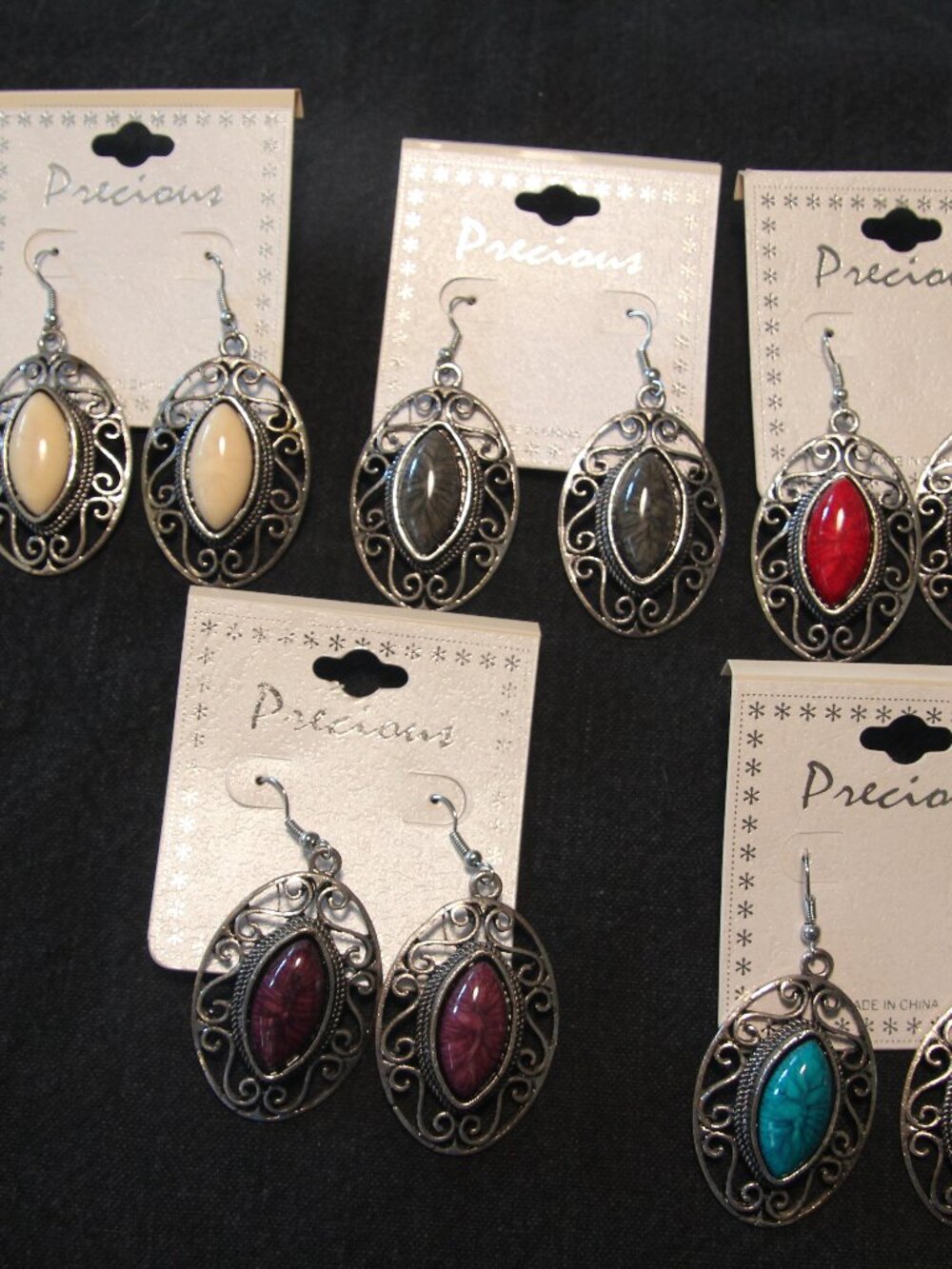 Earrings 5 for one price. Metal silvertone with faux stones. New with tags.